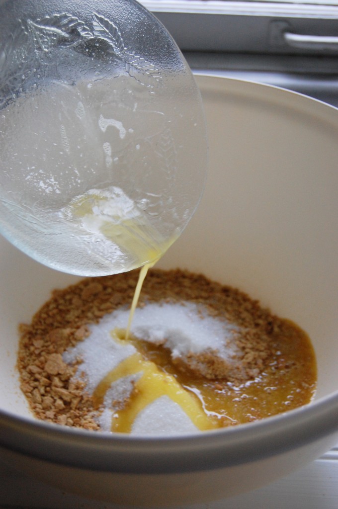 mixing ingredients for graham cracker crust