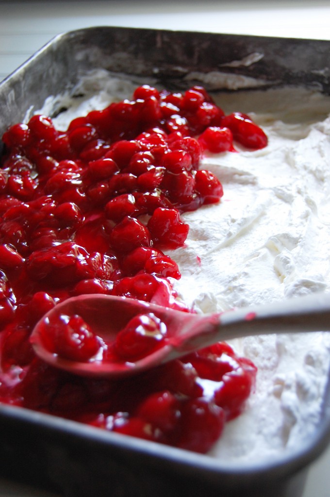 spreading cherries on dessert
