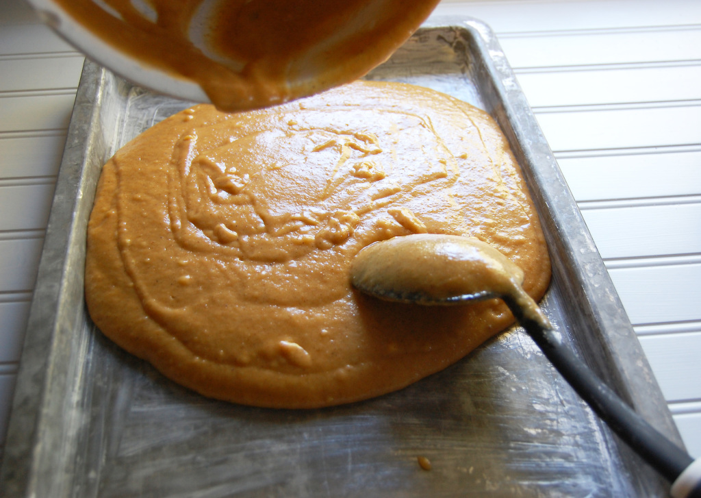 pouring in the pan for pumpkin bars