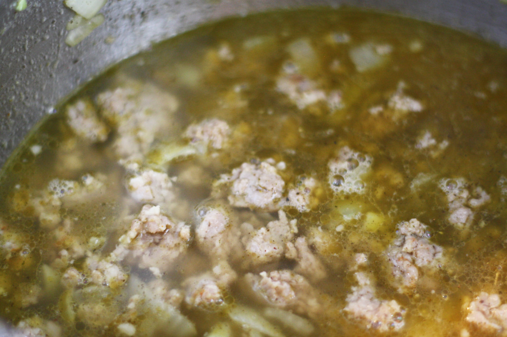 adding broth for stuffing