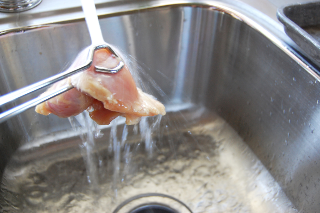 rinsing chicken