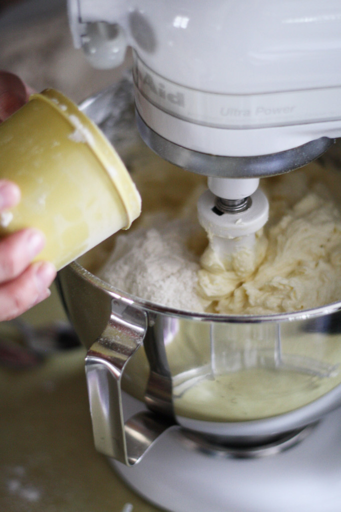 adding flour to sugar cookies