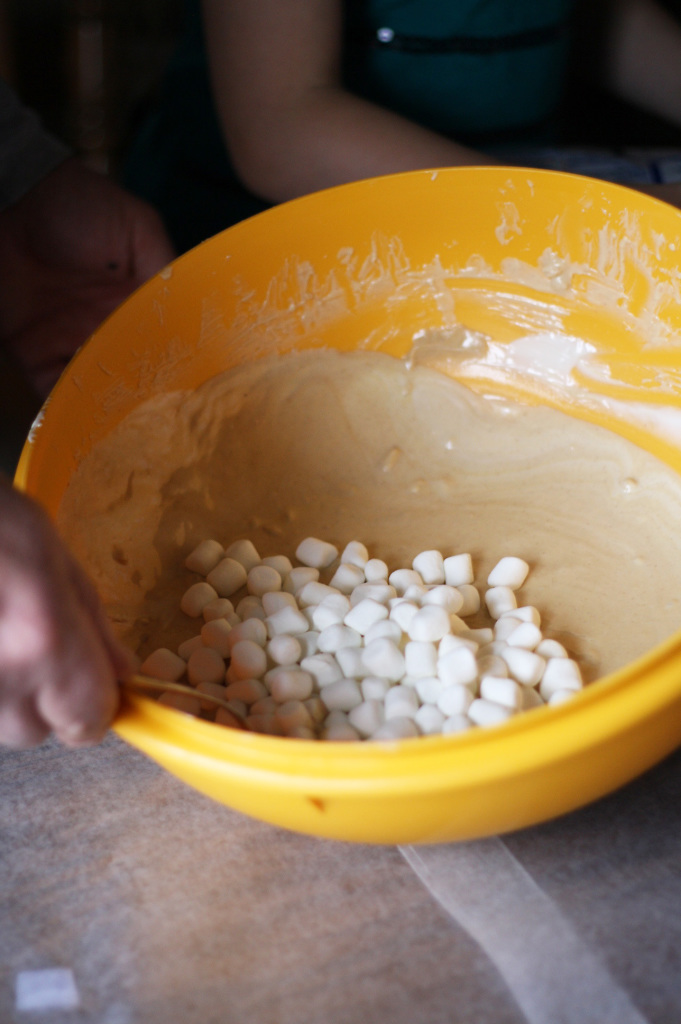 adding marshmallows to candy