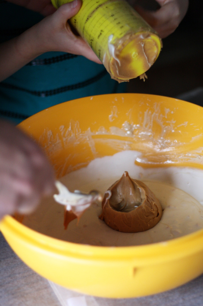 adding peanut butter to candy