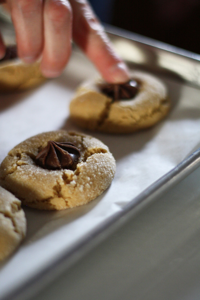 putting star candies on cookies