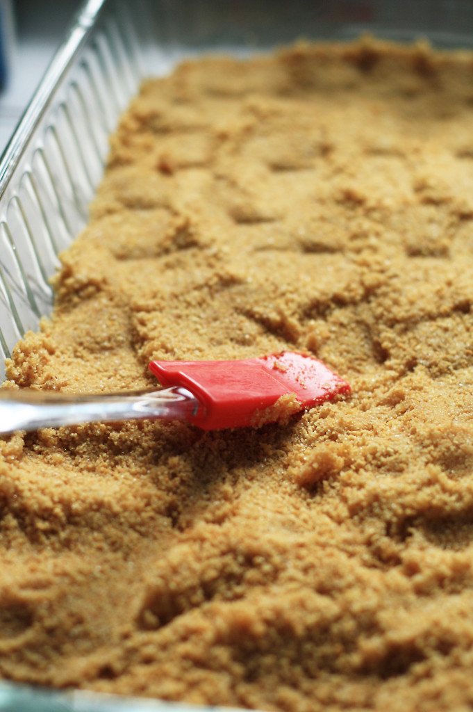 putting crumbs in pan