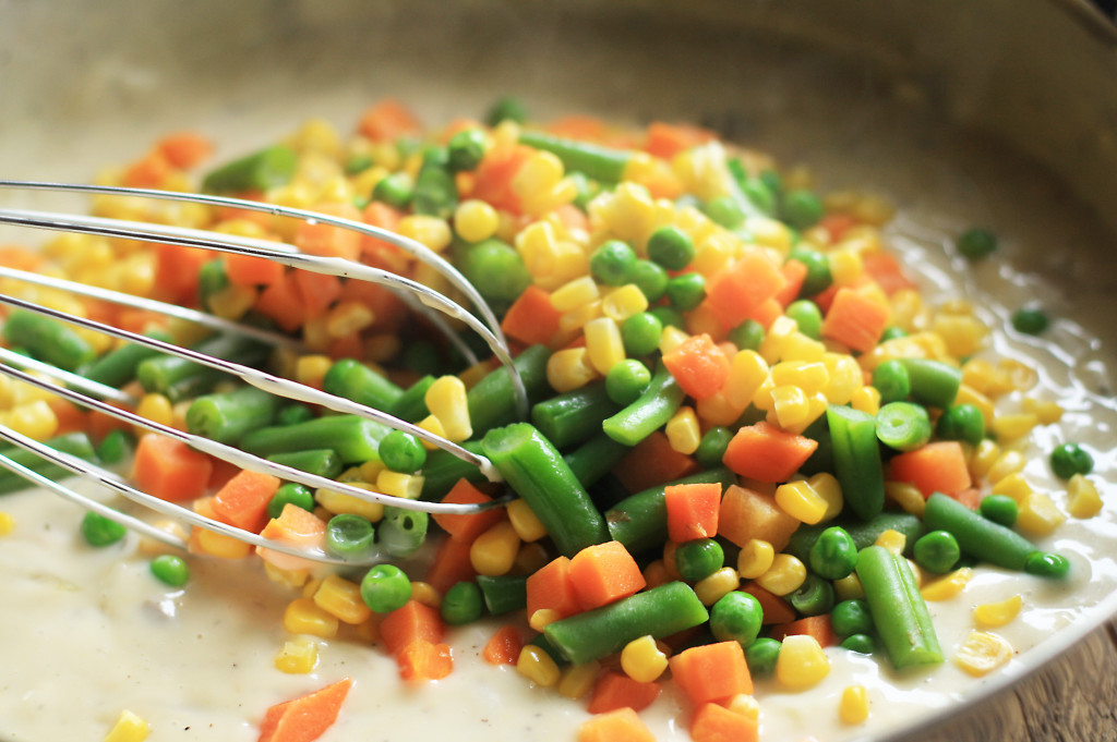 mixing in vegetables