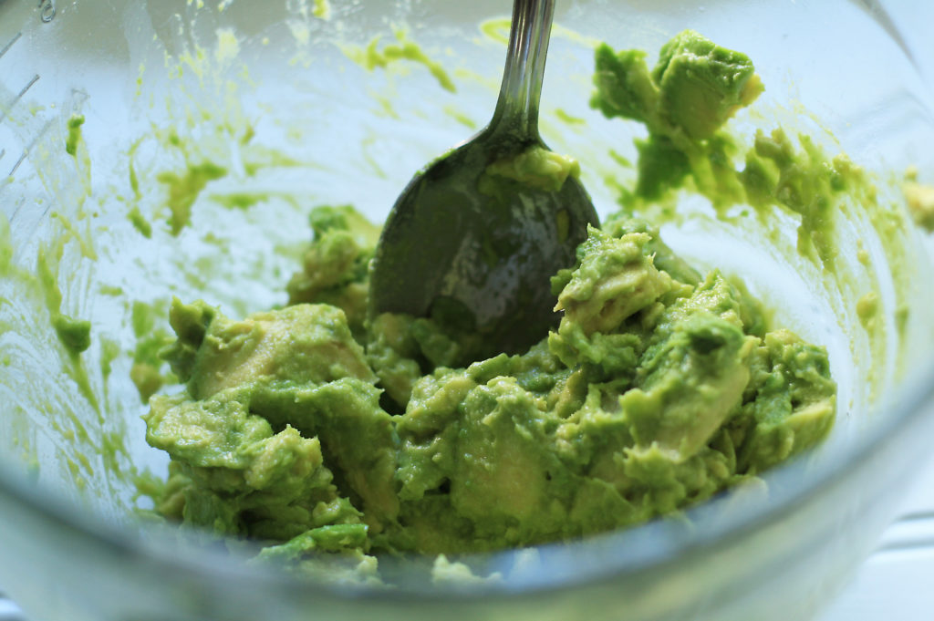 mixing guacamole